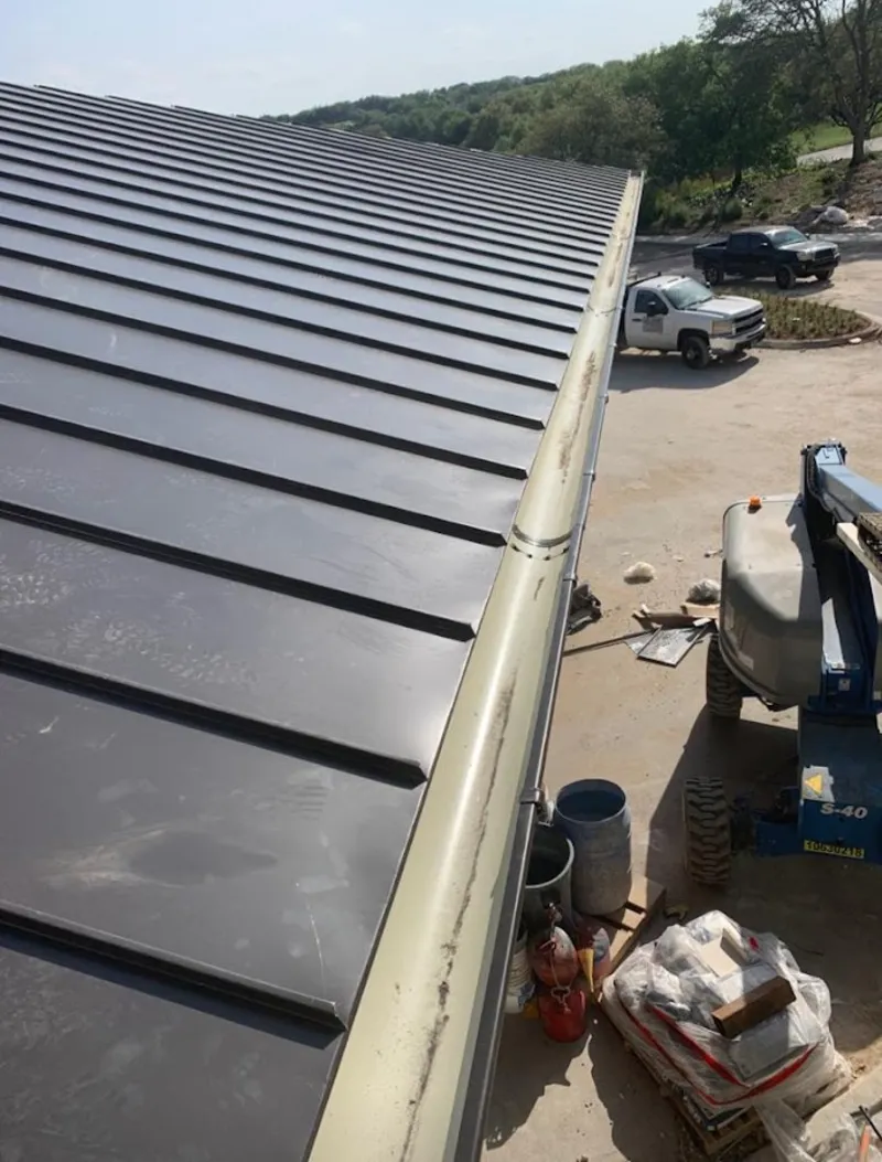 Standing seam panel and gutter detail on a metal roofing jobsite in Camp Pendleton South